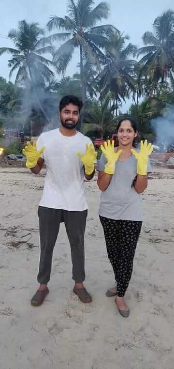 Newly married couple cleans beach