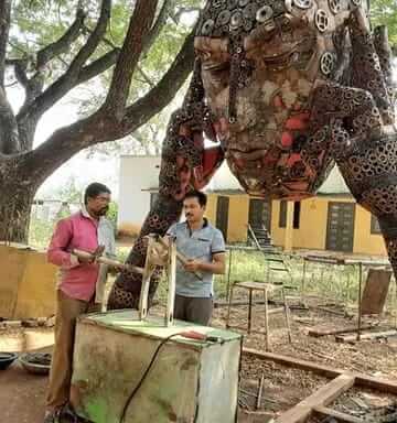 Metal scrap artist professor who is Upcycling materials and making beautiful idols