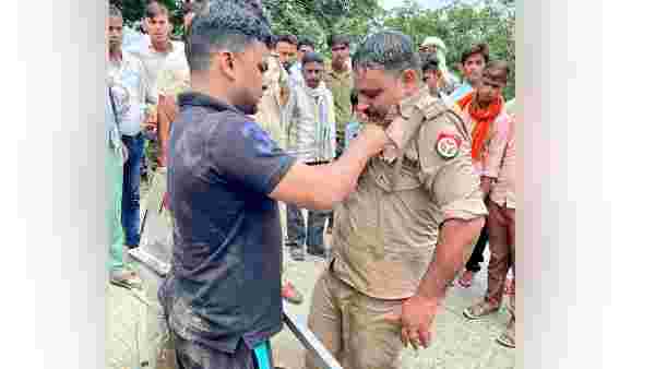 SI Ashish Kumar saved the life of a drowning man.