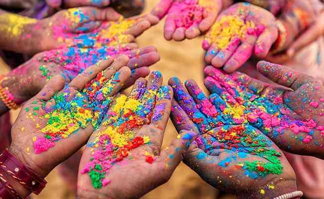 Why holi is celebrated what the main reason behind it