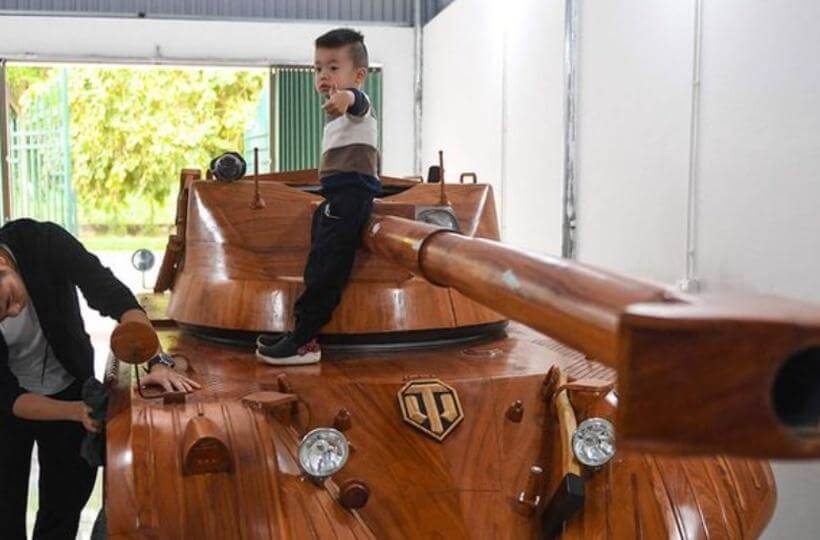 Father convert minibus to wooden tank for sun