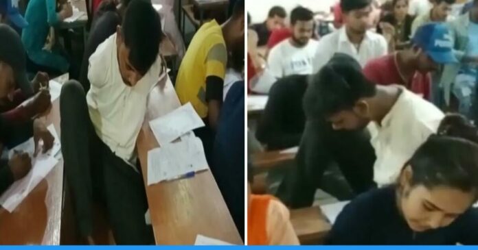 Bihar's Handicapped Youth Nandlal Kumar Writing exam copy with his feet