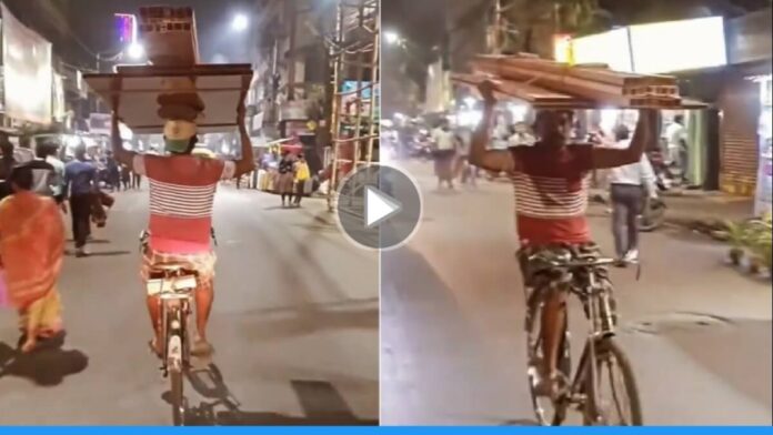 Viral video of man riding a bicycle without holding the handle